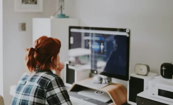 a woman working at a laptop