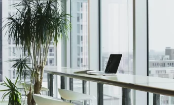 A laptop standing on the desk in the office